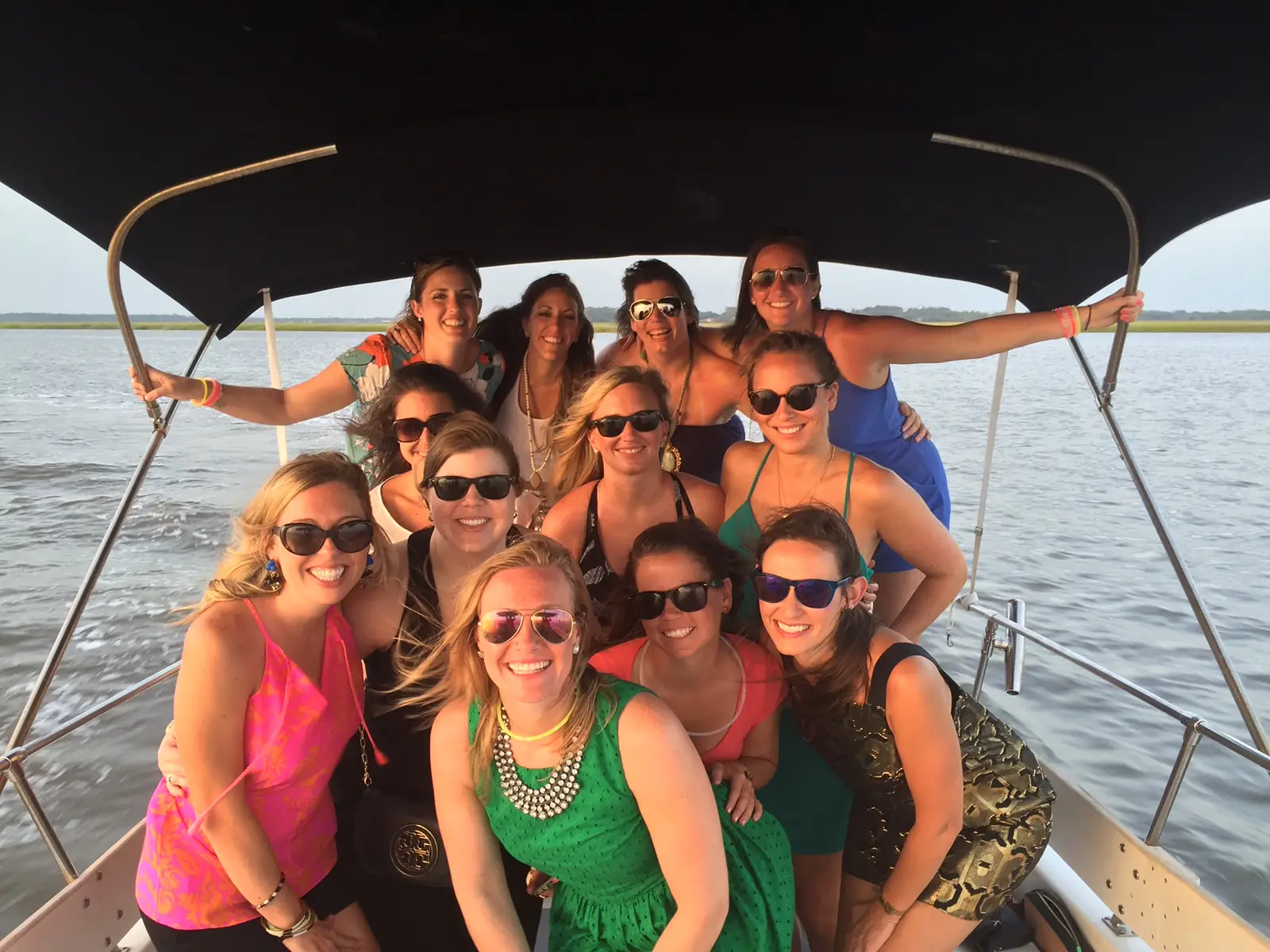 A bachelorette party celebrating on a private boat cruise