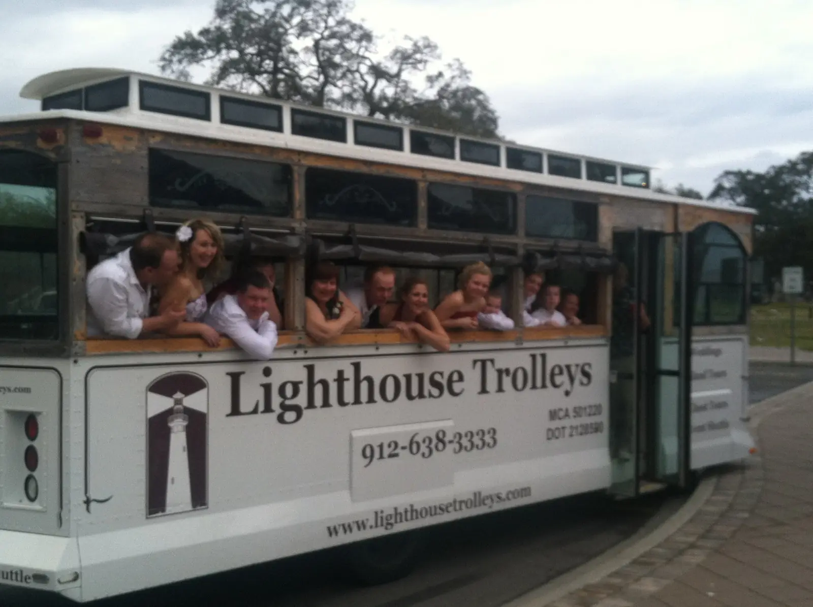Guests riding in a Lighthouse Trolleys open-air trolley