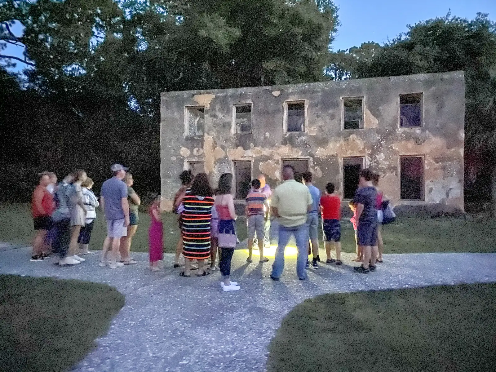 A tour group at the tabby walls of a historic ruin on Jekyll Island