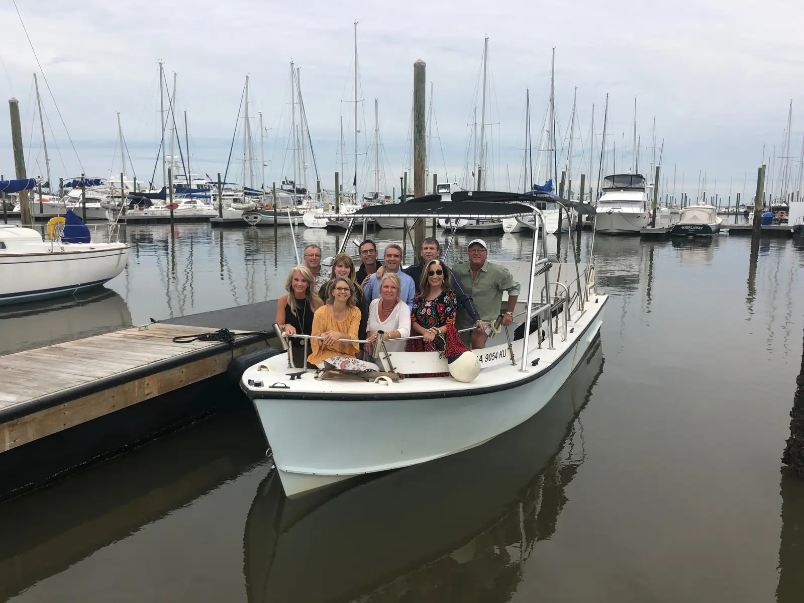 Our boat the Puddle Shuttle at the marina with guests aboard